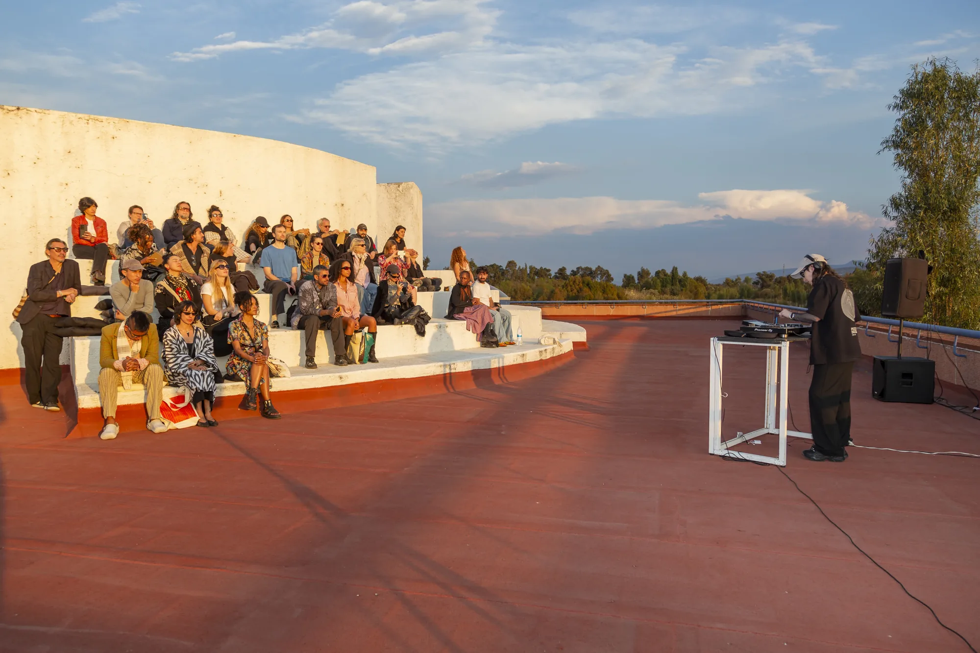 Rooftop audience at sunset during Aki Aora 2025
