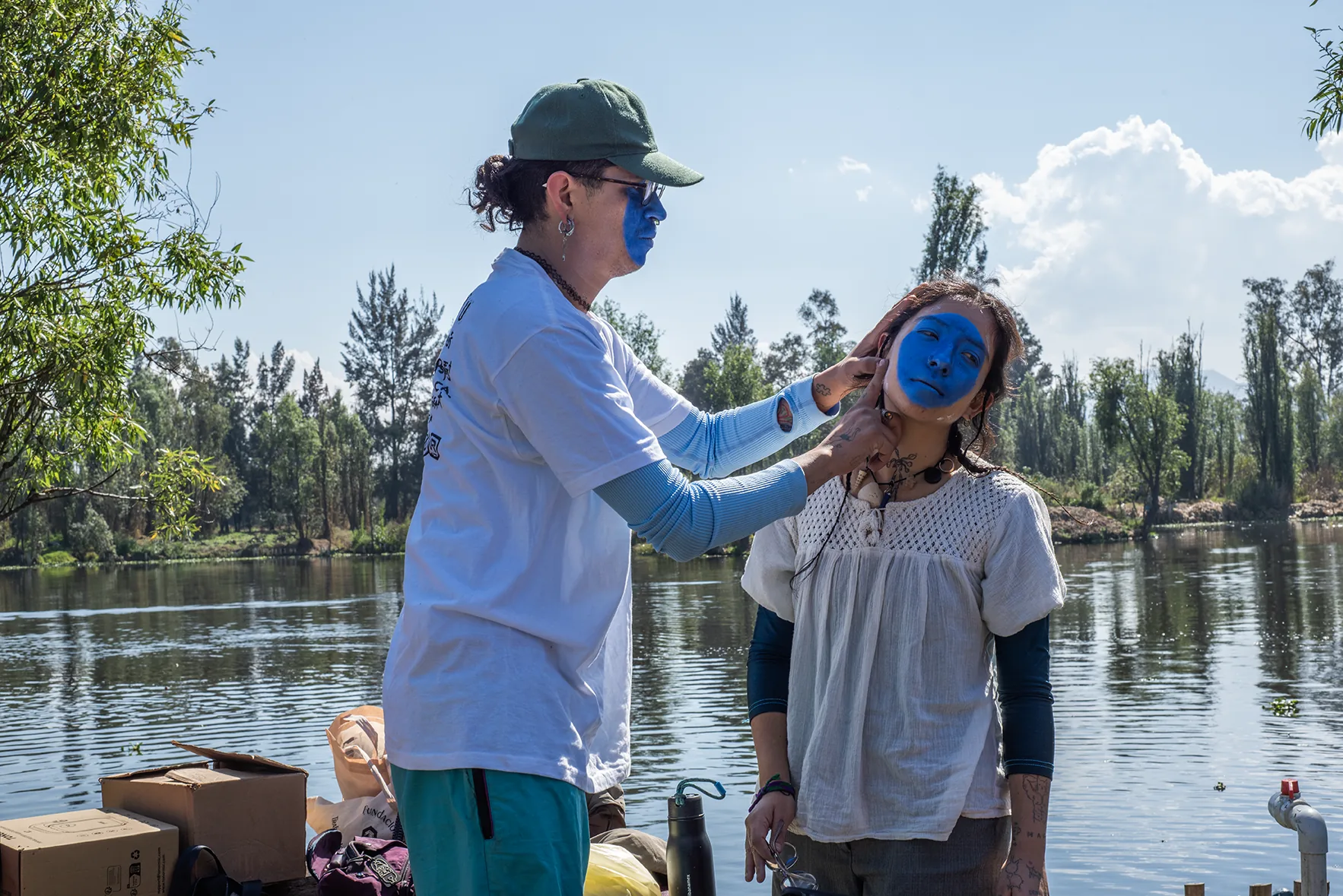 Face-painting a performer by the canal, Aki Aora 2025