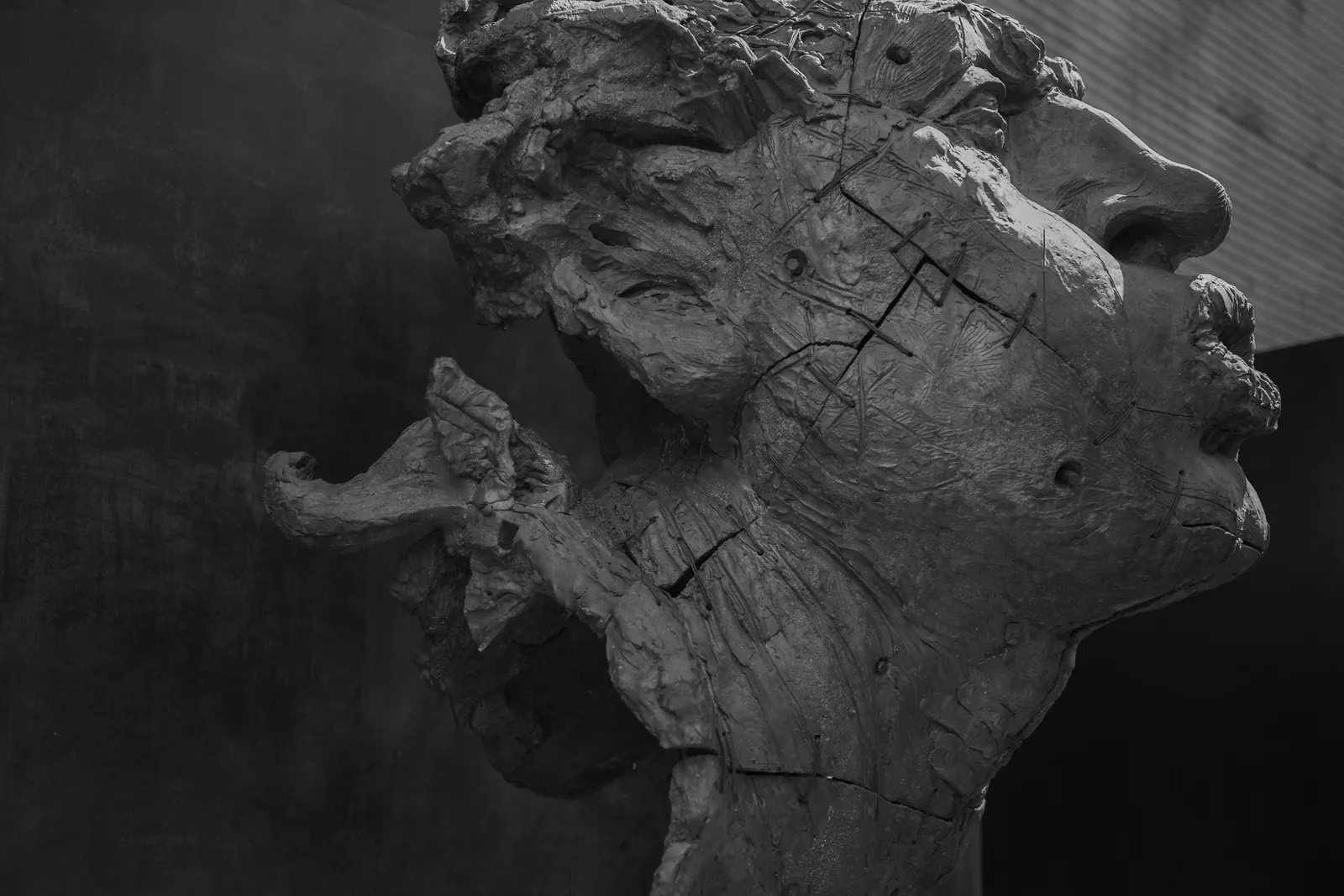 Monumental wooden legs sculptures in gallery