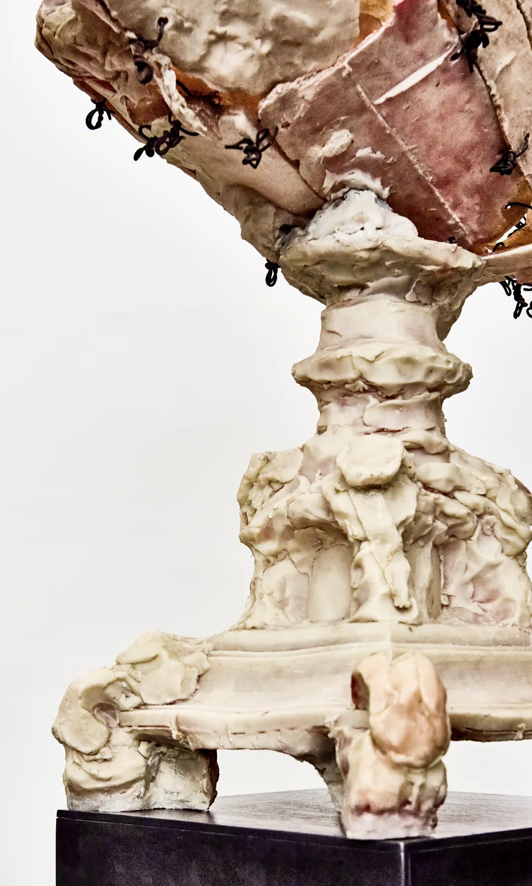 Wire-stitched sculptural fragments on a pedestal, detail