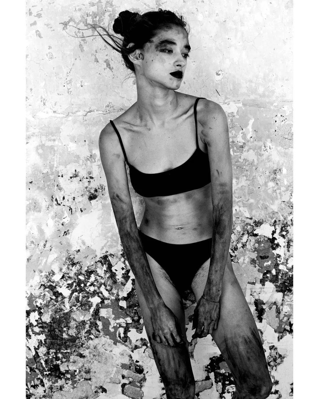 Editorial portrait against textured wall