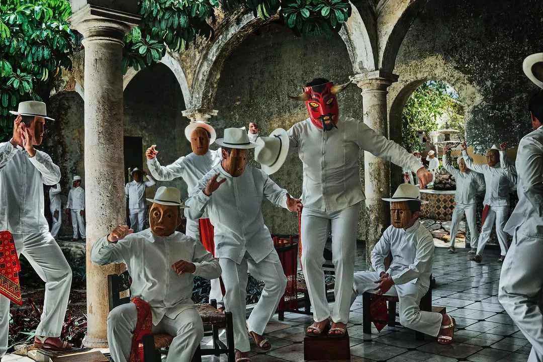 Masked dancers in the hacienda, Yucatán