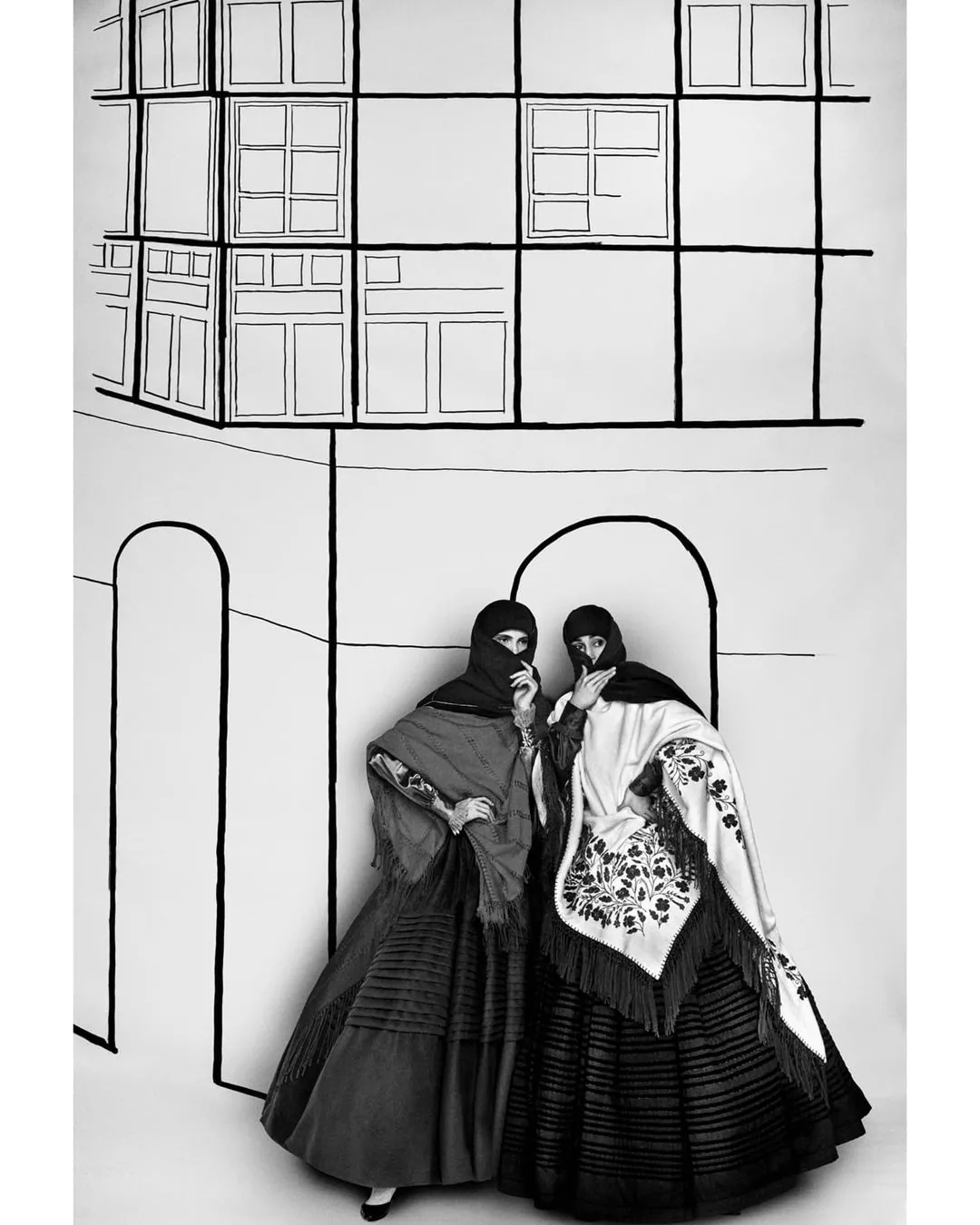 Two figures with rebozos, illustrated backdrop
