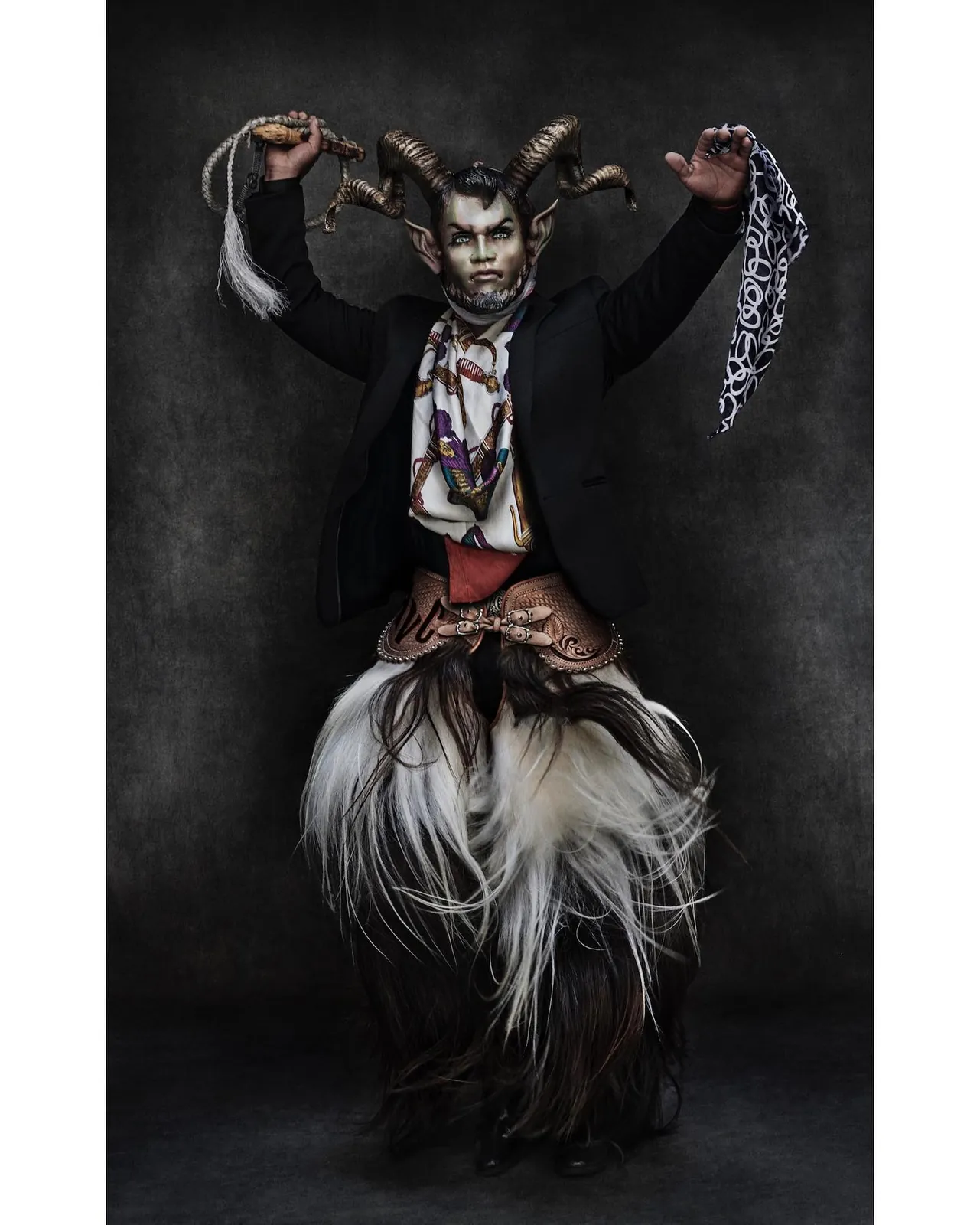 Horned masked figure, black jacket